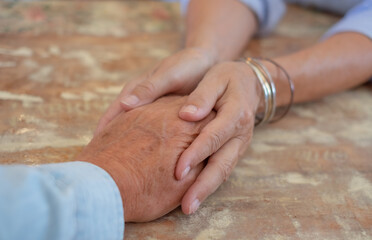 Old people holding hands close up view, senior retired family couple express care and psychological...