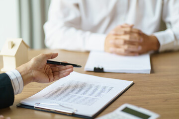 Obraz premium Business people signing contract making deal with real estate agent Concept for consultant home insurance.Real estate investment Property insurance security. Real estate agent offer house.