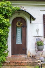 Fototapeta na wymiar Old wooden house door in austrian small town