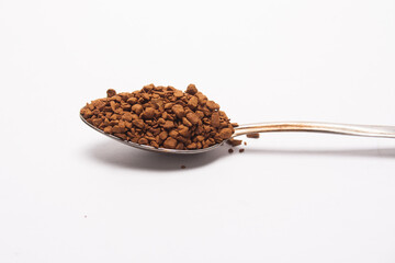 instant coffee in a spoon on a white background