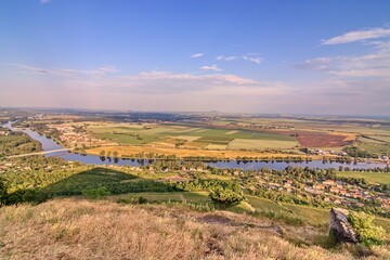 Fototapeta na wymiar A view to the river Labe surrounded by flat landscape near Litomerice, Czech republic