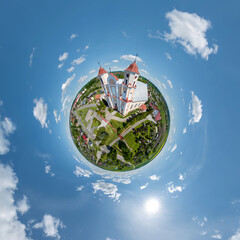 little planet transformation of spherical panorama 360 degrees overlooking church in center of...