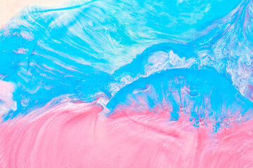 Multicolored creative abstract background. Texture of acrylic paint. Stains and blots of alcohol ink pink blue colors, fluid art.