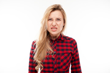 Portrait angry blonde young woman screaming isolated on white studio background, showing negative emotions