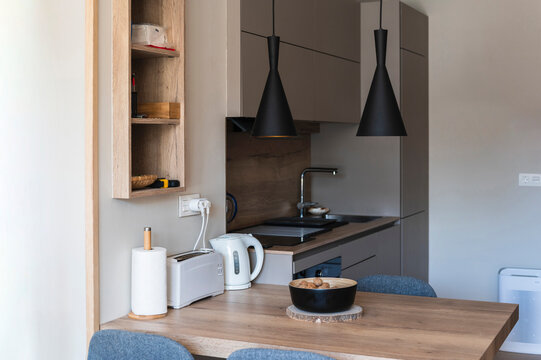 Bowl of dried nuts placed on dining table in kitchen