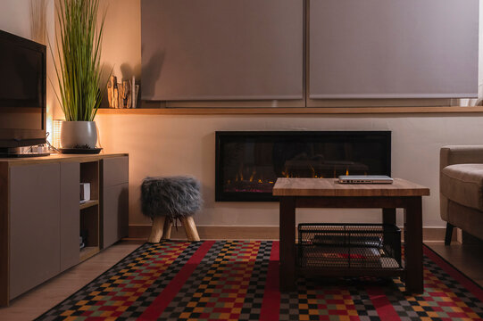 Interior of modern living room with fireplace and TV