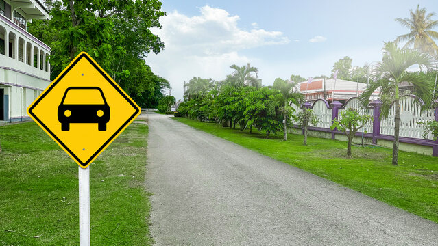 Yellow sign with painting car on the road side to allow only cars to enter the area edited with blurred trees in background