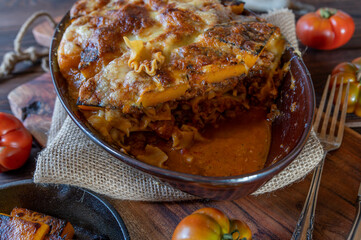 Noodle casserole with meat sauce and roasted pumpkin cheese topping.