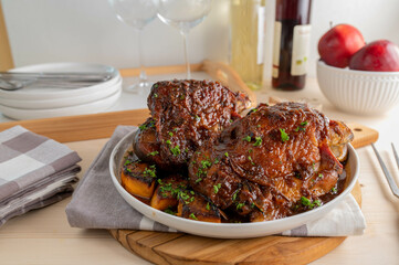 Sunday or holiday meat dish with oven roasted turkey shanks and vegetables