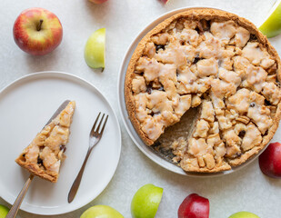 Apple pie on white background from above