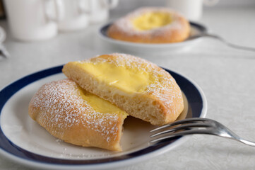 Pastry with pudding filling on a plate