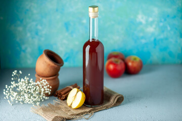 front view apple vinegar with apples on blue background food drink red fruit alcohol wine sour...