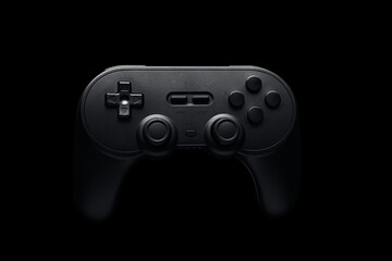 Black video game controller on black background. Wireless joystick tech, Online games, console setup. Nerdy youth, challenges, screen time. Time for entertainment, play, fun. 