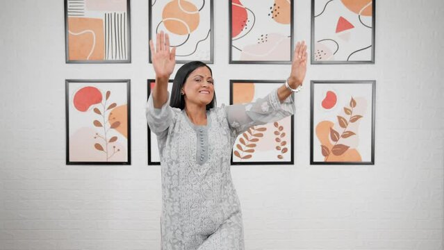 Indian mother dancing and doing bhangra