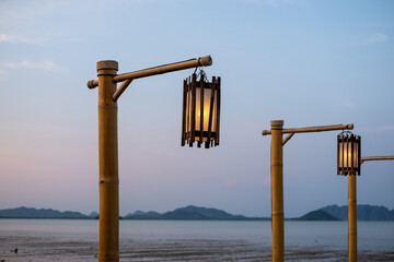 Bamboo lamp post with view of the sea on the background