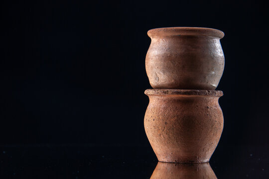 front view brown little pots on black background ceramics color darkness plate ancient food meal free space
