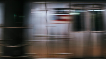 Blurred American flag on a moving train