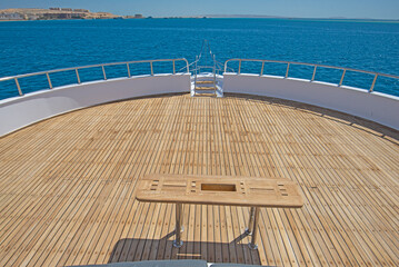 Table on large bow deck of a luxury motor yacht