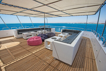 Table and chairs on sundeck of a luxury motor yacht