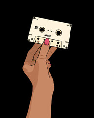 Woman's hand holding beige cassette - black background