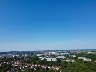 An Airplane is Approaching London Luton Airport to Land. The Footage Was Captured on June 13th, 2023 with Drone's Zoomed in Camera from Low Altitude.