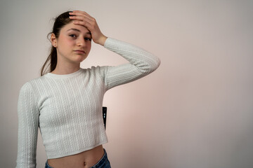 Young teen girl over isolated background and looking at camera