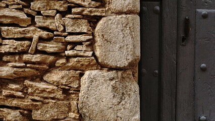 rustic stone wall and wooden door