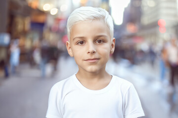 portrait of a white-haired boy on a city street