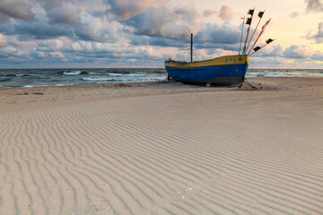 Fototapeta na wymiar Beautiful fishing boat on the beach in Rewal.