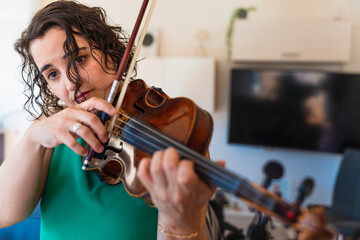 Concert-Bound: Young Violinist Rehearsing Diligently at Home
