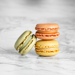 Macaroons stacked close up on a marble background
