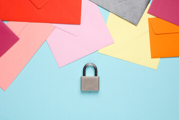 Lots of envelopes and padlock on blue background. Top secret information