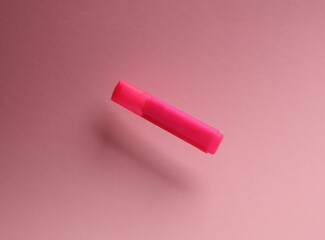 Pink felt-tip pen or marker floats on pink background with shadow