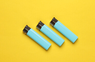 Lighters on yellow background. Minimalism.
