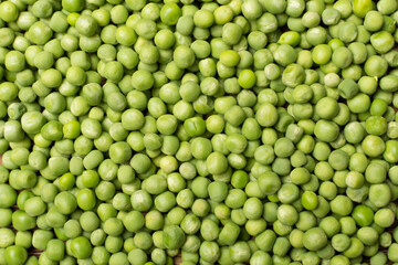 Fresh green peas as background, top view