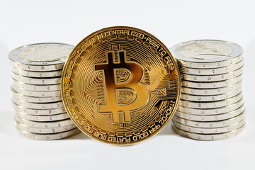 Golden bitcoin with euro coins.