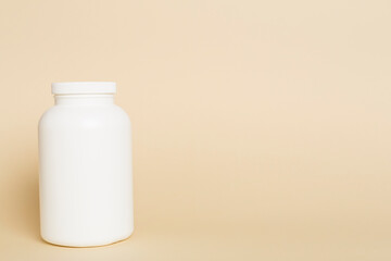 Plastic bottle for vitamins on color background