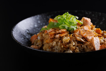 Japanese fried rice yakimeshi isolated in black background - 613268057