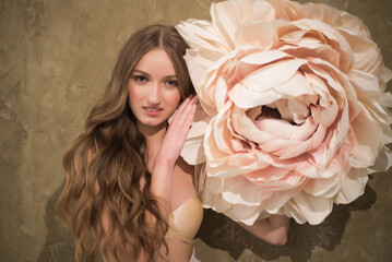 Stylish fashion woman with big decorative flower