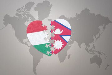 puzzle heart with the national flag of nepal and hungary on a world map background.Concept.
