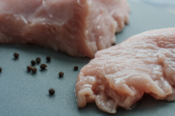 Fresh turkey meat on cooking board closeup. High quality photo