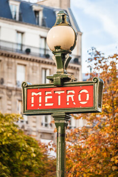 Red Paris metro subway entry sign