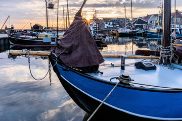 boats in the port of Urk, Netherlands at sunset - obrazy, fototapety, plakaty