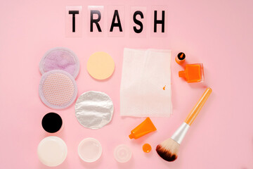 Cosmetic products not recyclable on a pink background. Beauty trash. flat lay, top view 