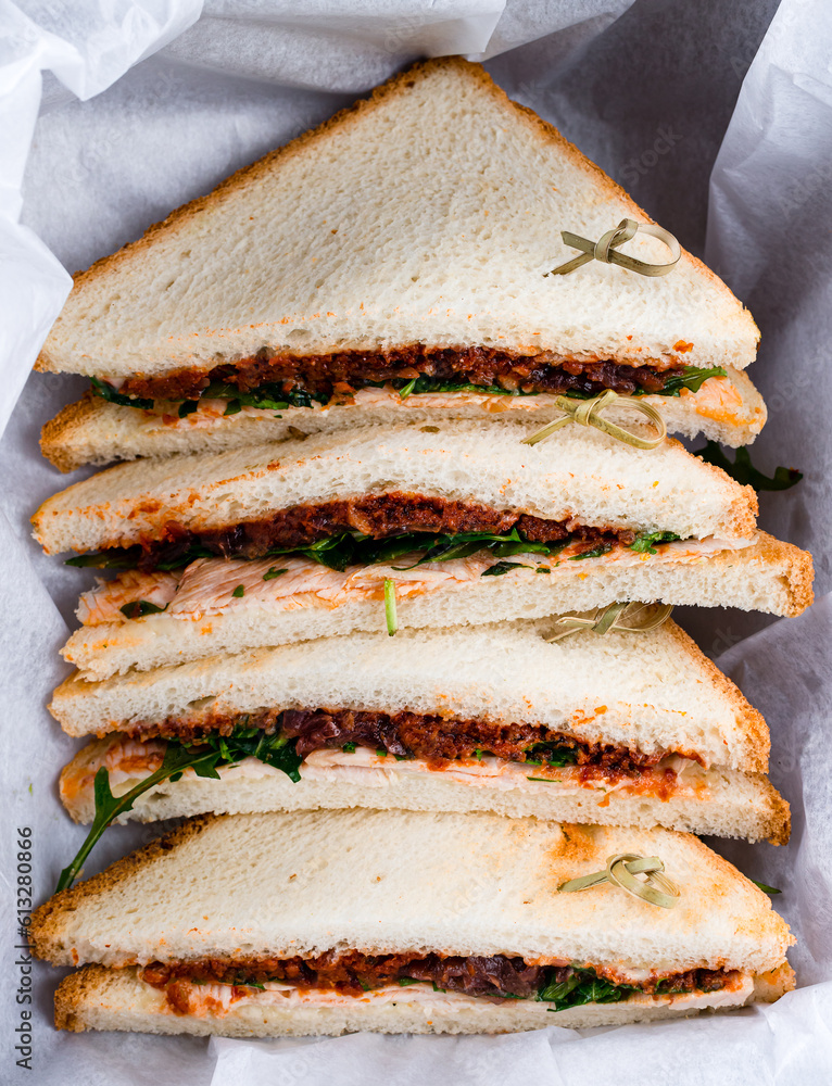 Wall mural Sandwiches with chicken ham, ground beef, tomatoes and greens.