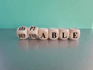Adaptable or dependable symbol. Turned wooden cubes and changes the word dependable to adaptable....