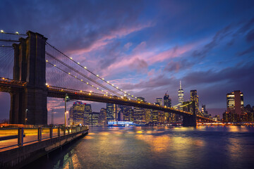 Panoramic view on Brooklyn bridge and Manhattan at dusk, New York City
