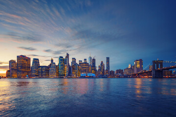 Panoramic view on Manhattan and Brooklyn bridge at dusk, New York City