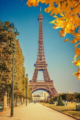 Eiffel Tower over blue sky at autumn in Paris, France
