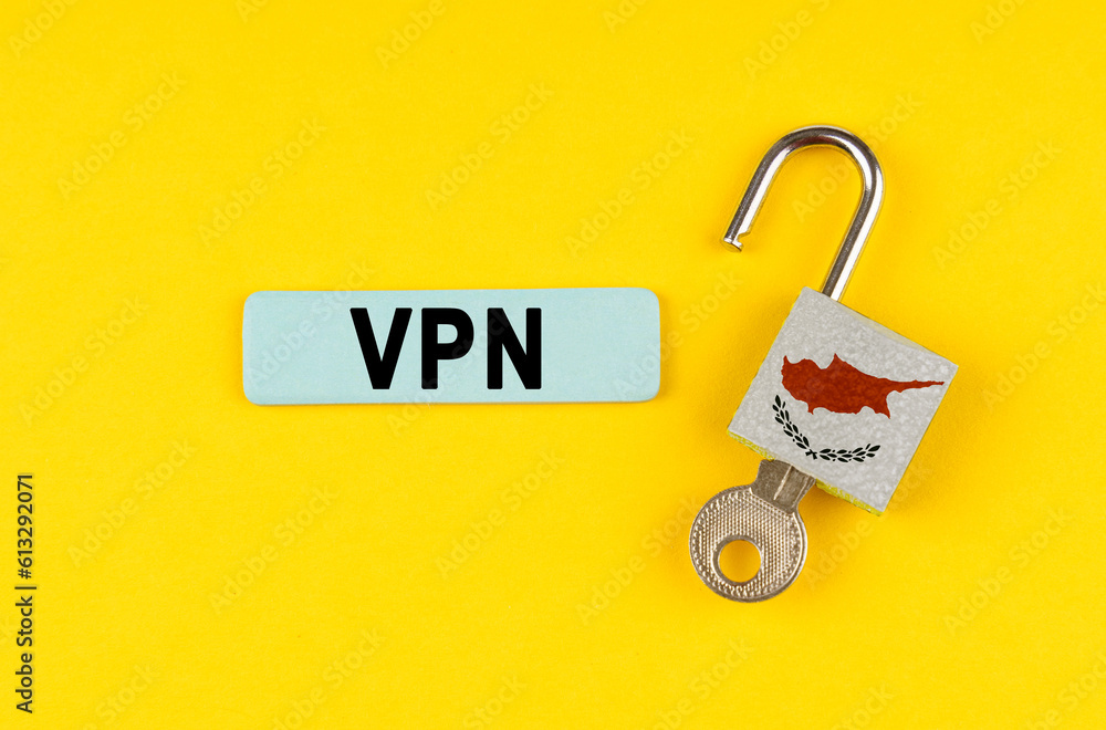 Poster on the yellow surface is an open lock with a key and a sticker with the inscription - vpn